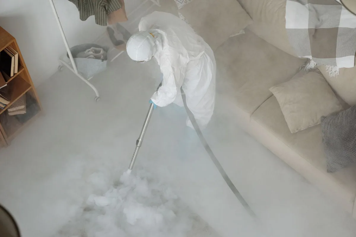 Biohazard cleanup technician in protective equipment, Fulton, KY